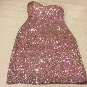 Pink sequin strapless dress.